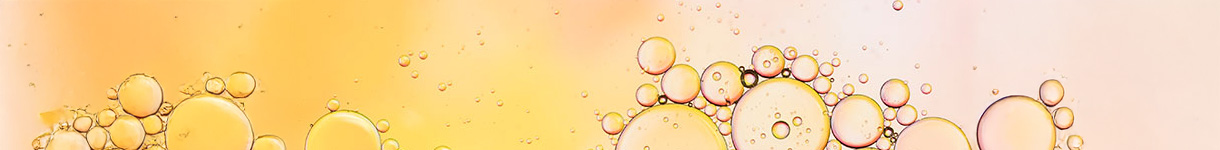 Golden bubbles representing the purity and lightness of clean beauty ingredients.