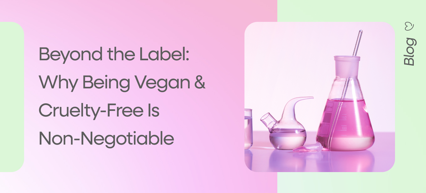 Laboratory glassware filled with pink skincare formulas, representing vegan and cruelty-free beauty ingredients.