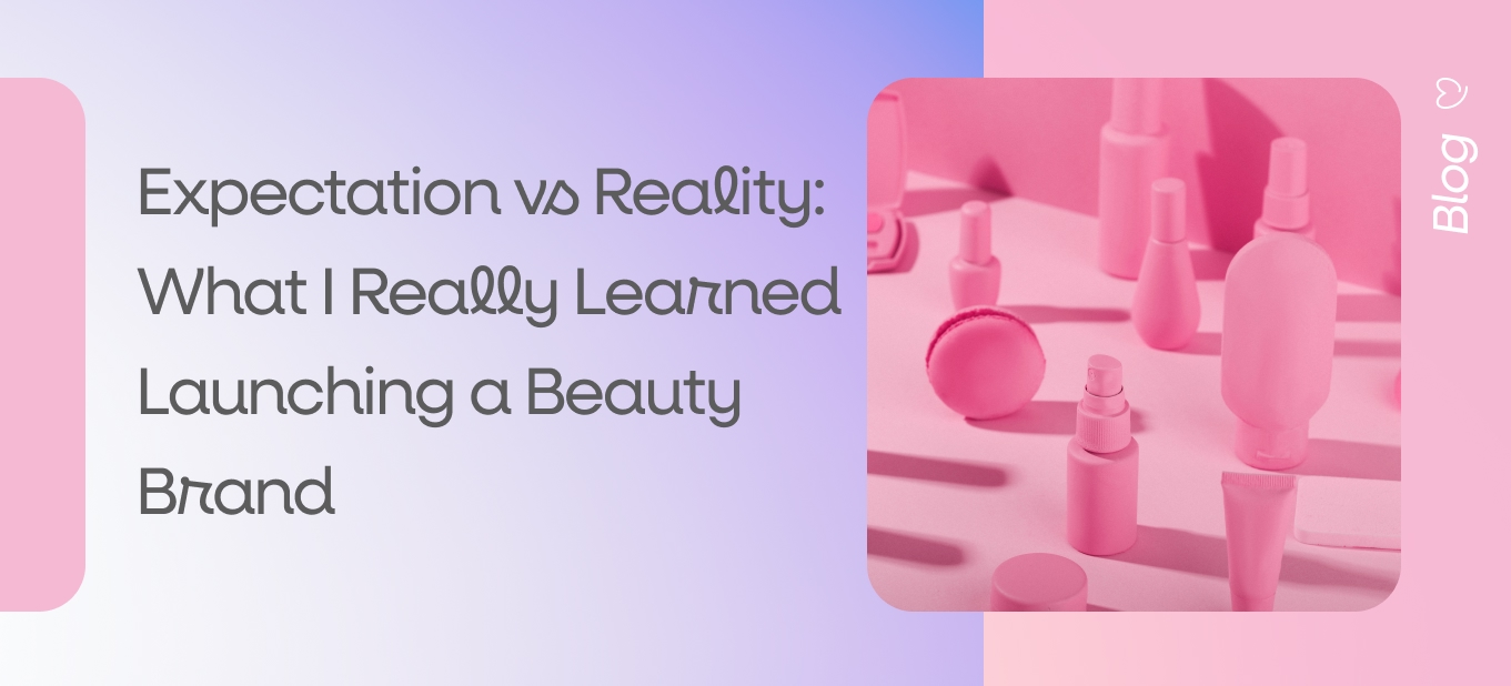 Pink-toned beauty products arranged on a pastel background, representing the realities of launching a beauty brand
