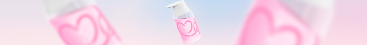 Floating Dear Me Romantic pink fragrance bottles on a soft pastel background