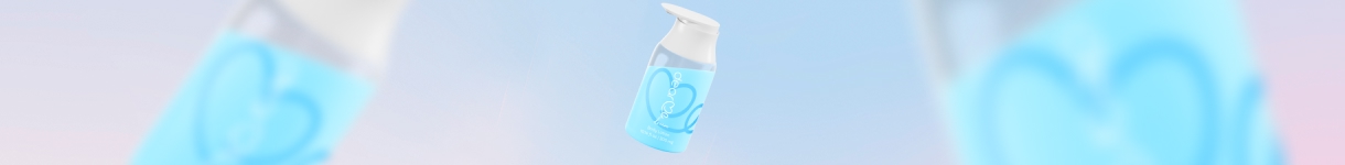 Floating Dear Me Dream blue fragrance bottles on a pastel gradient background